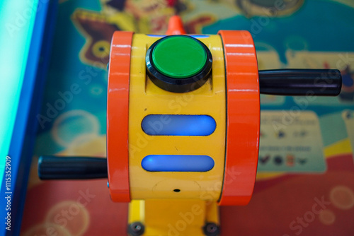 Close-up of a vibrant arcade game control panel. The colors are bright and playful. Vibrant Arcade Game Control Panel Close-Up. photo