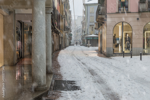 Frost and snow in Italy. City under heavy snowfall. Snow covered a street in the historic center of Varese, corso Matteotti, northern Italy photo