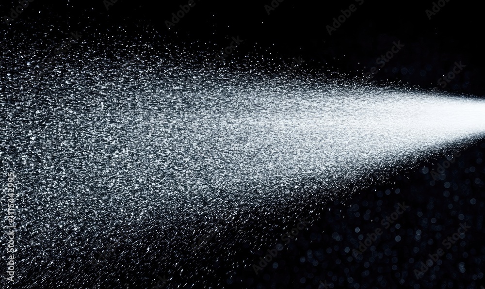 Obraz premium A spray of white mist is shooting out of a nozzle