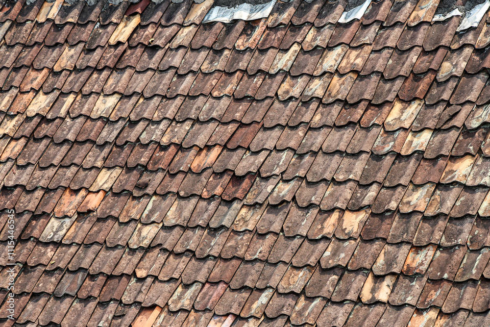 Close-up view of aged, weathered clay roof tiles. Rich texture and history. Awe-Inspiring Texture and History of Ancient Roof Tiles. Close-up view of aged, weathered clay roof tiles. Rich texture and history. Awe-Inspiring Texture and History of Ancient Roof Tiles.