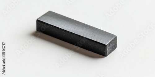 Closeup view of a blackboard eraser placed on a whiteboard, highlighting the blackboard eraser s texture and design while showcasing its purpose and functionality on the whiteboard surface. photo