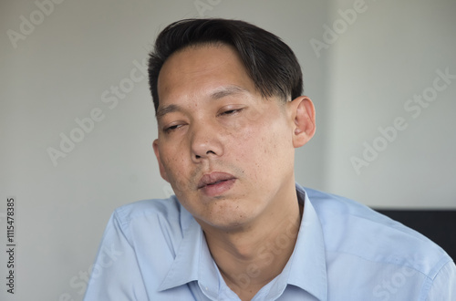 Fotografie Tired, exhausted and sleepless Middle Aged Asian man with insomnia, concept imag