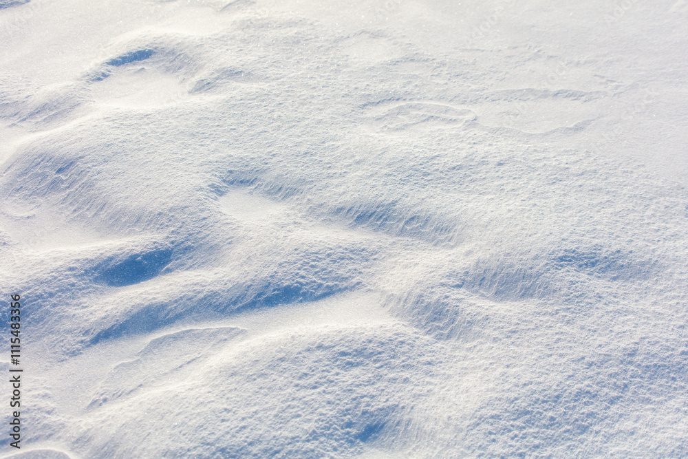 A snow covered ground with a few footprints A snow covered ground with a few footprints