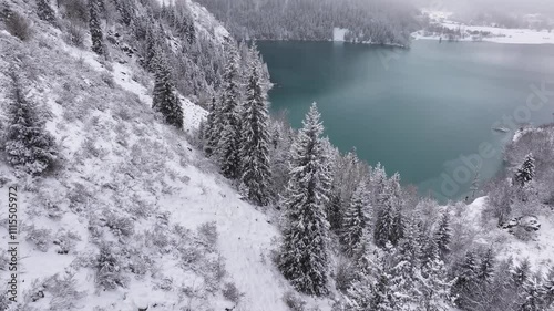 Mountain lake. Winter. Snowy mountains. Clouds