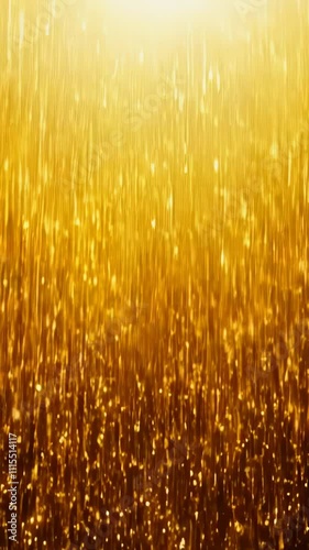 Golden particles falling like glitter against a dark backdrop, evoking glamour and celebration. Ideal for festive or elegant themes with an abstract touch.