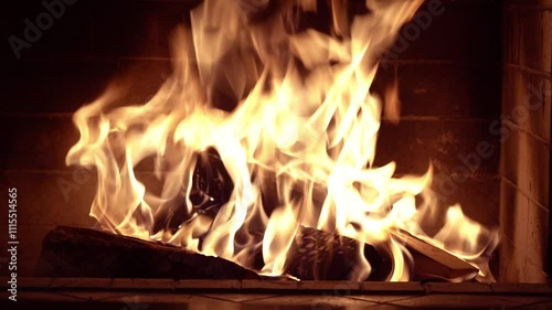 A fire burns in a fireplace, winter vacation in country house,close up