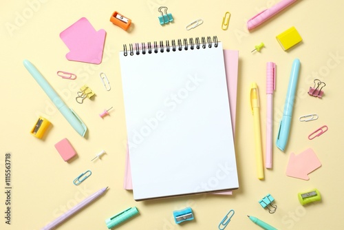 Flat lay with school notebook and stationery on color background, top view