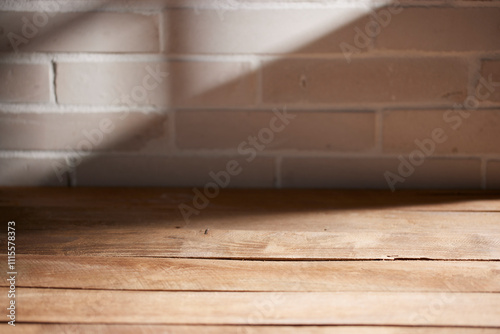 Various objects and vintage brick background with
shadows of sunlight coming through the window. photo