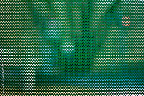 green perforated metal sheet with round holes