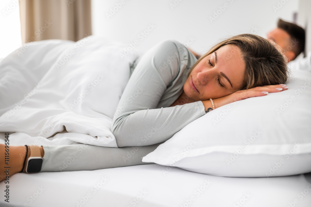 Young married couple is sleeping in their bed. Young married couple is sleeping in their bed.