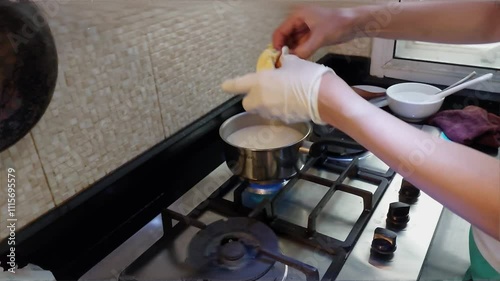 A female cook tears durian flesh. To put into a pot of coconut milk, to make a food that Thai people call 