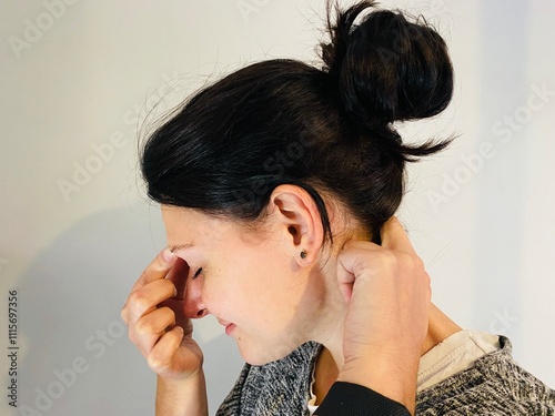 woman using pressure point therapy headache
