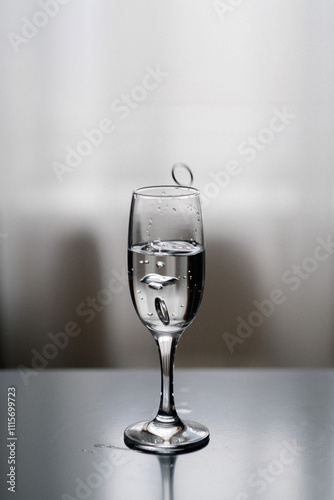 A still life of three glasses filled with diferent coloured liquid photo