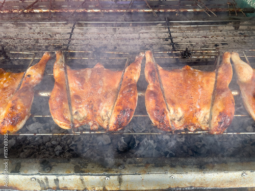 Grilled chicken on a charcoal stove