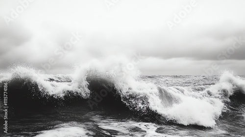 A black and white photo of ocean waves crashing in the water.