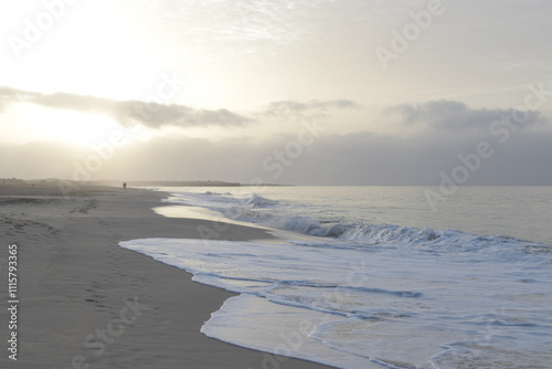 Beautiful sunrise on gloomy morning in Cabo Verde on the beach of Atlantic Ocean.