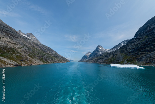 Prins Christian Sund Greenland mountain fjord with floating ice and shore iceberg on a summer day photo