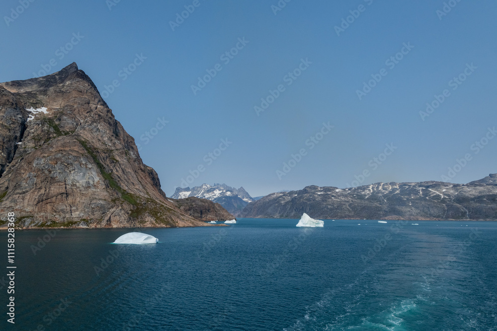Fototapeta premium Prins Christian Sund Greenland mountain fjord with floating ice and shore iceberg on a summer day