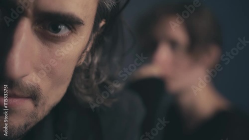 Cinematic Couple Smiles Close Up A tough guy shares a warm smile with his girl in the background capturing their gentle connection and love