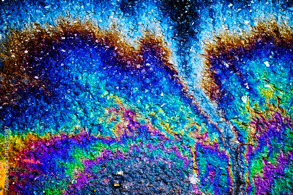 Fototapeta premium Oil stain on Asphalt road after rain, color Gasoline fuel spots on Asphalt Road