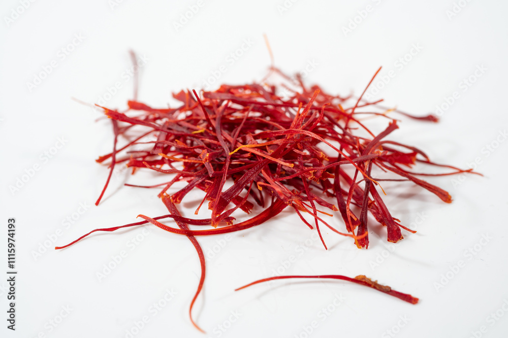 Fototapeta premium Dried bright red saffron isolated on white background.