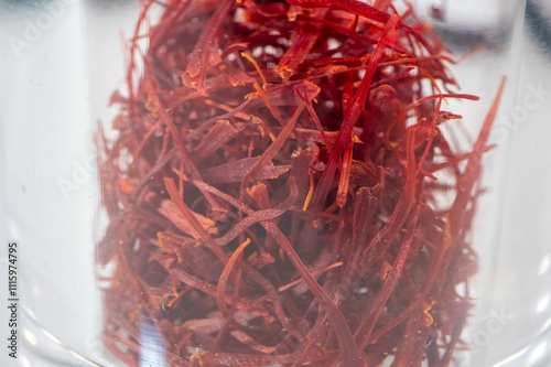 Dried bright red saffron isolated on white background. photo