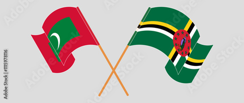 Crossed and waving flags of Maldives and Dominica. Vector illustration