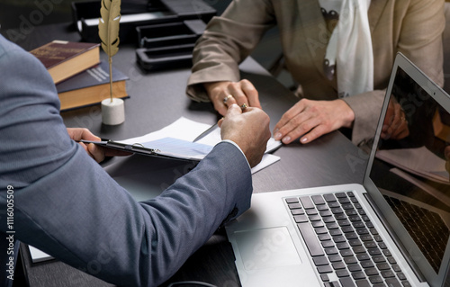 Salesmen are letting the male customers sign the sales contract, Asian women and men are doing business in the office, Business concept and contract signing
