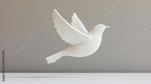 Plaster figurine of a bird in mid-flight, emphasizing motion and serenity photo