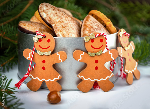 gingerbread person and cookies with on christmas tree and decorations