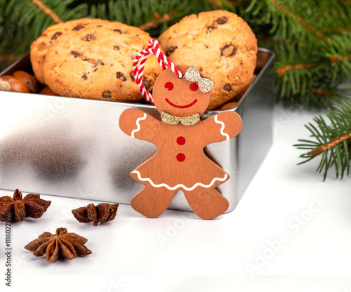 gingerbread person and cookies with on christmas tree and decorations