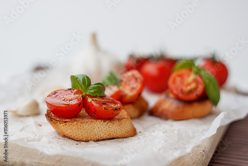 Close-up of bruschetta with fresh cherry tomatoes, basil and garlic
