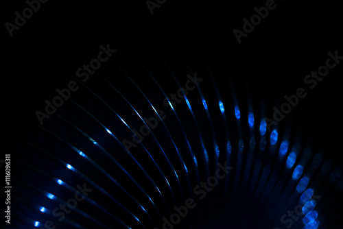 Abstract background illuminated,  springy steel, glowing lines