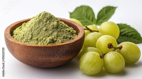 Indian gooseberry powder in wooden bowl with fresh fruit and green leaf on white background healthy organic food concept