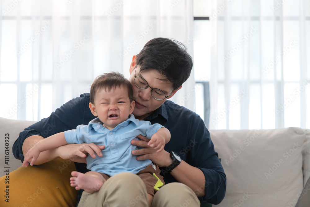 Father and son play together after dad comes home from work Father and son play together after dad comes home from work