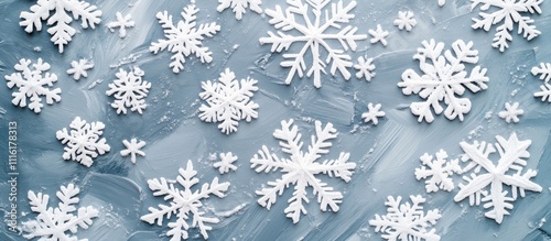 White snowflakes floating on a gray background perfect for winter holiday decorations and seasonal themed designs. photo