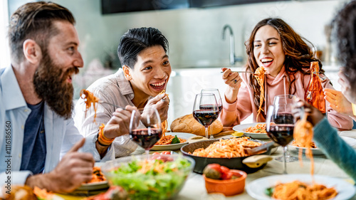 Fotografie Happy multicultural friends having pasta dinner party at home - Multiracial peop