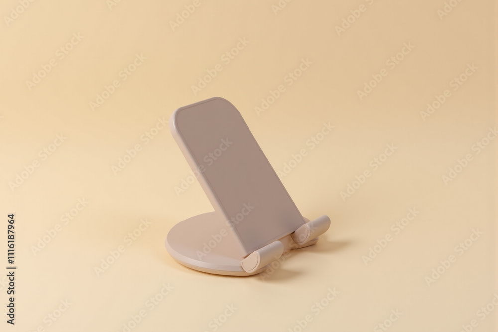 Modern smartphone holder on a pastel soft beige background Modern smartphone holder on a pastel soft beige background