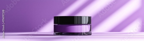 A sleek purple cosmetic jar sits on a soft purple surface, illuminated by subtle light, showcasing a modern and stylish design.