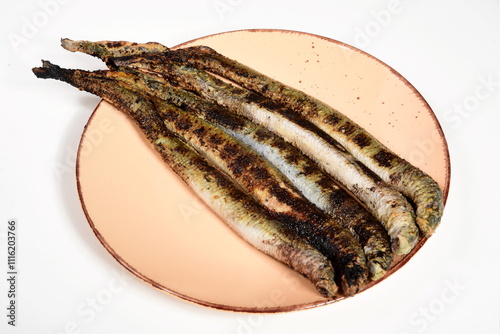 Fried lampreys on a plate and in a dish. Latvian lamprey recipes photo