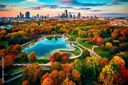 Obraz na płótnie Beautiful panoramic drone sunset view on skyline, the skyscrapers of Warsaw City and Pole Mokotowskie (Mokotow Field) in the colors of the golden Polish autumn - is called the