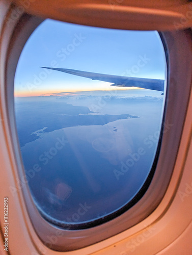 Photography airplane window view at sunrise over ireland