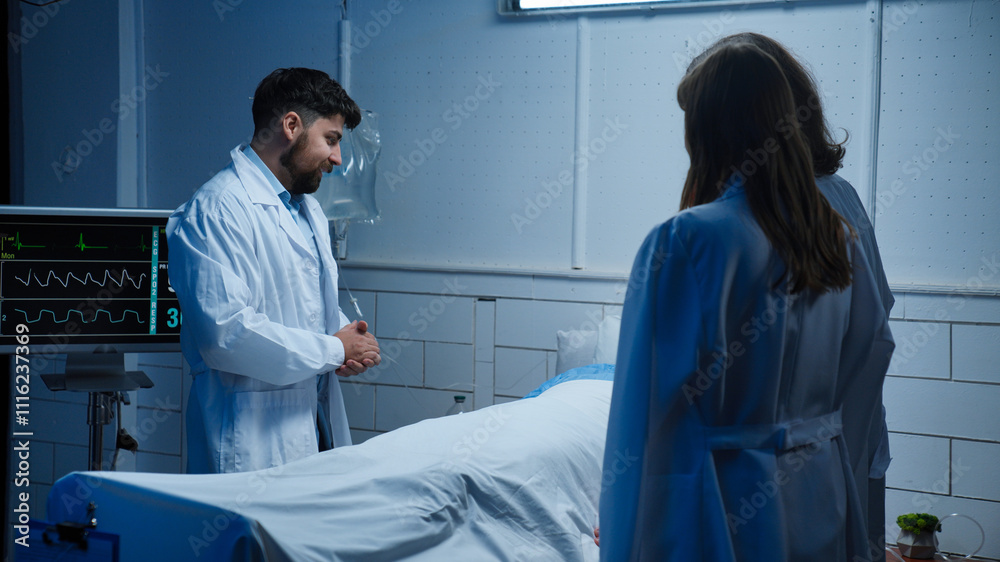 Obraz premium Adult man patient laying in hospital bed, ready to discharge, friends visiting and talking, doctor came to talk about results, positive expression.