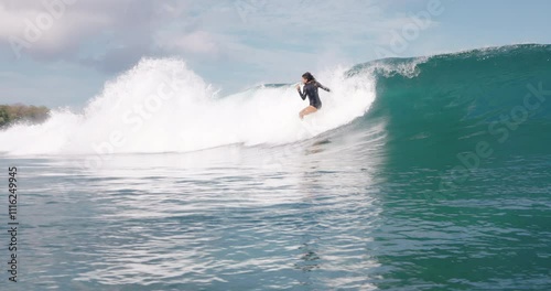 Surfer woman fell off a ocean wave. Wipe-out surf girl
