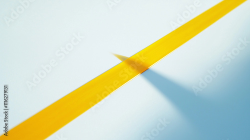 Paintbrush painting a yellow line on white surface 