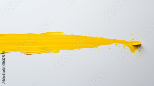 Paintbrush painting a yellow line on white surface 
