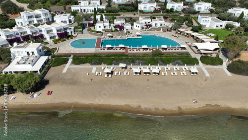 Obraz na płótnie Aerial drone photo of picturesque seaside fishing village of Vathy featuring landmark chapel of Taxiarchis, Sifnos island, Cyclades, Greece w salonie