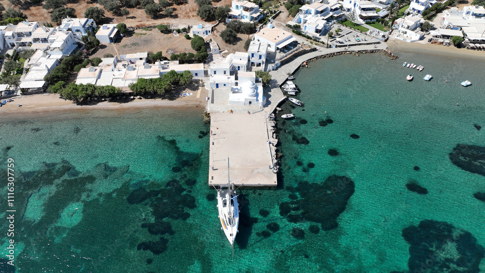 Aerial drone photo of picturesque seaside fishing village of Vathy featuring landmark chapel of Taxiarchis, Sifnos island, Cyclades, Greece