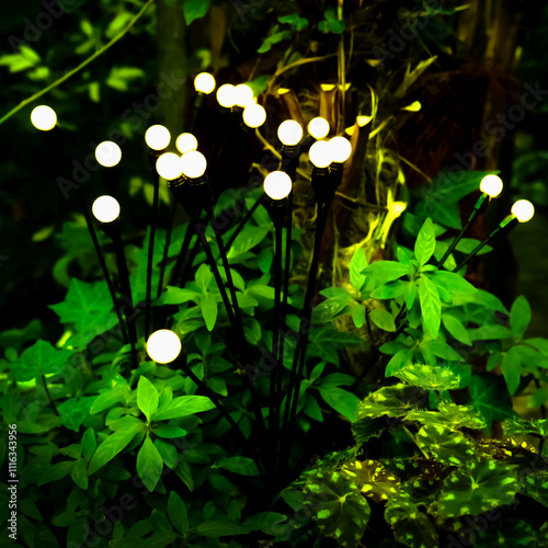 solar garden light in a flower bed at night, energy saving concept