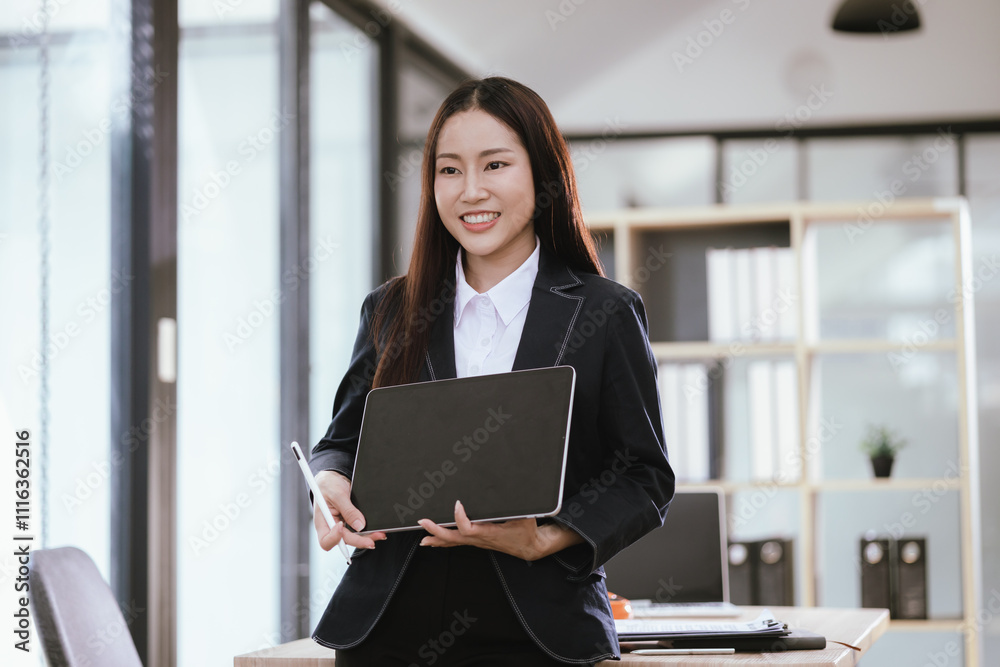 Beautiful Asian businesswoman in modern office Beautiful Asian businesswoman in modern office